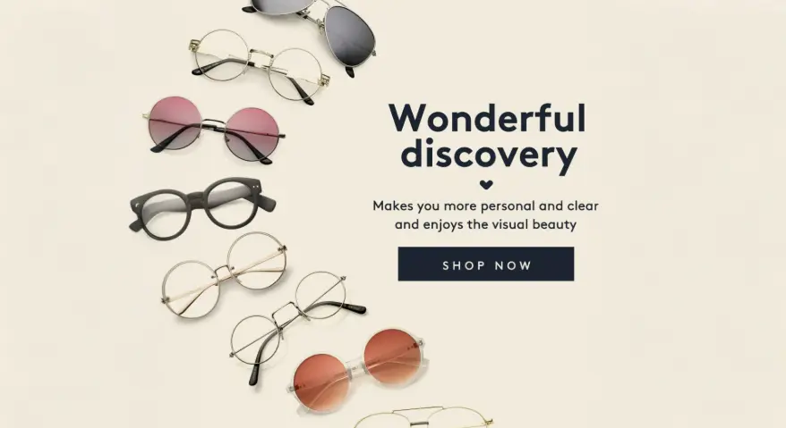 A minimalist-style display of eyewear, featuring a variety of sunglasses and prescription frames—including aviator, round, and bold-rimmed styles—arranged in a semi-circular arc.
