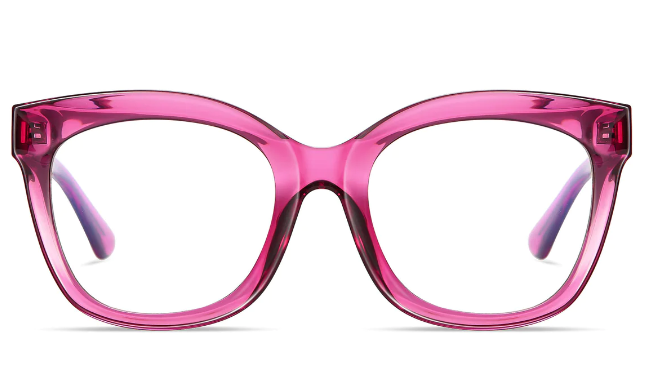 A pair of transparent peach-pink, oversized cat-eye glasses, viewed from the front; the frames are thick and possess a modern aesthetic.