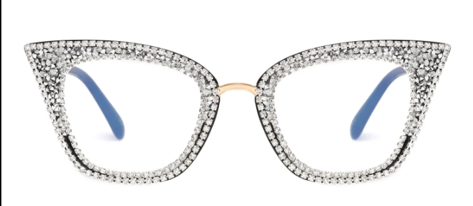 A pair of exquisitely glamorous cat-eye glasses, with the entire frame densely encrusted with sparkling white rhinestones and a gold-colored bridge.