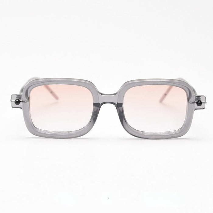 Front view of semi-transparent, square-framed sunglasses in a grayish-purple hue, featuring light orange gradient lenses.