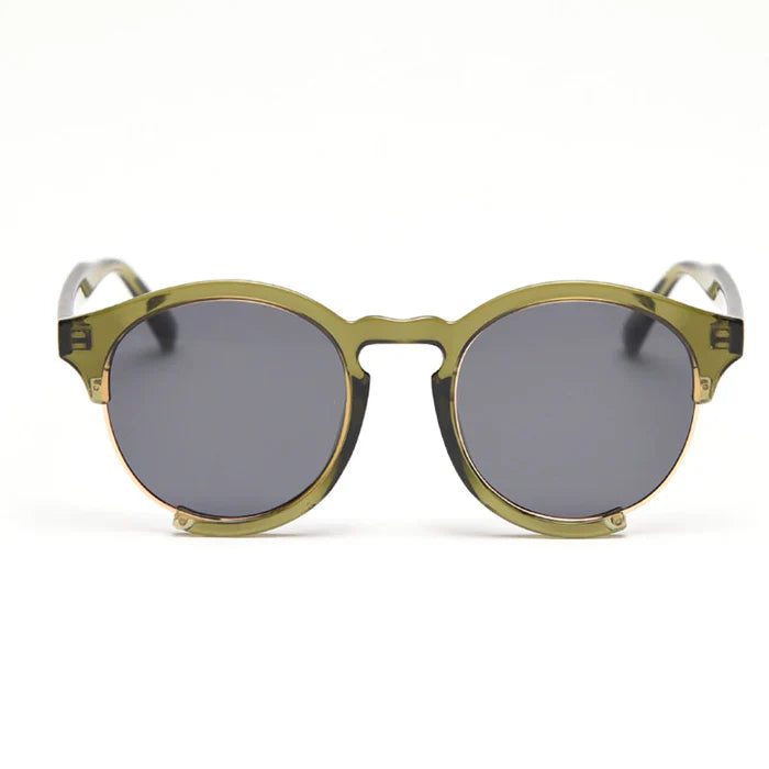Translucent olive-green sunglasses featuring a half-rim frame, fitted with dark gray lenses and outlined along the lower edge by a fine gold metal wire.