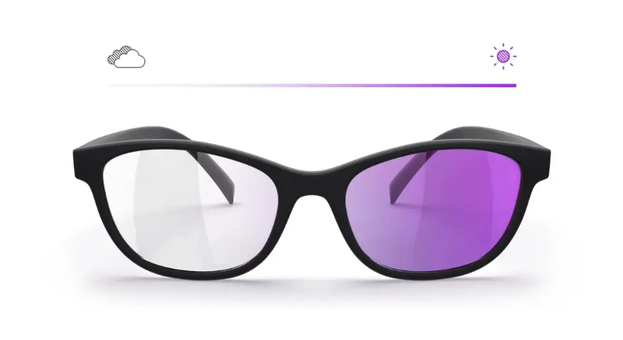 An illustration of photochromic lenses, featuring a pair of glasses that demonstrates the contrast between the transparent left side (indoors/overcast) and the purple right side (outdoors/in sunlight).