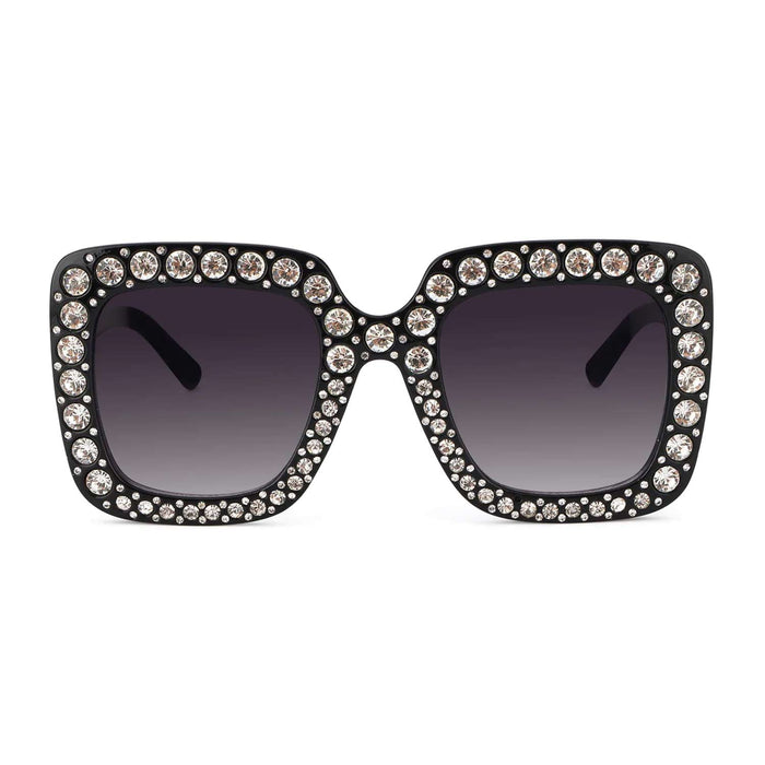 A front view of a pair of large, luxurious-style black square-frame sunglasses, with the edges of the frames encrusted with sparkling faux diamonds.