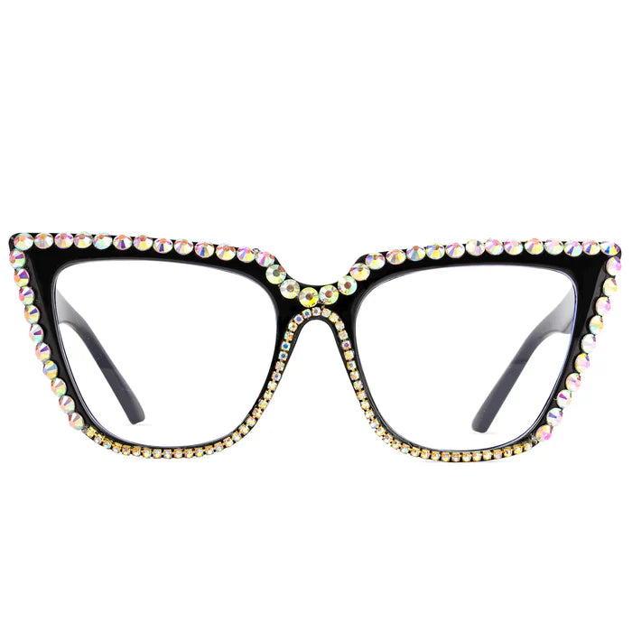 A front view of a pair of oversized black cat-eye glasses, with frames fully encrusted with round, iridescent rhinestones.