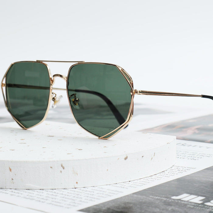 Polygonal sunglasses with thin gold metal frames and dark green lenses, featuring a double-bridge design.