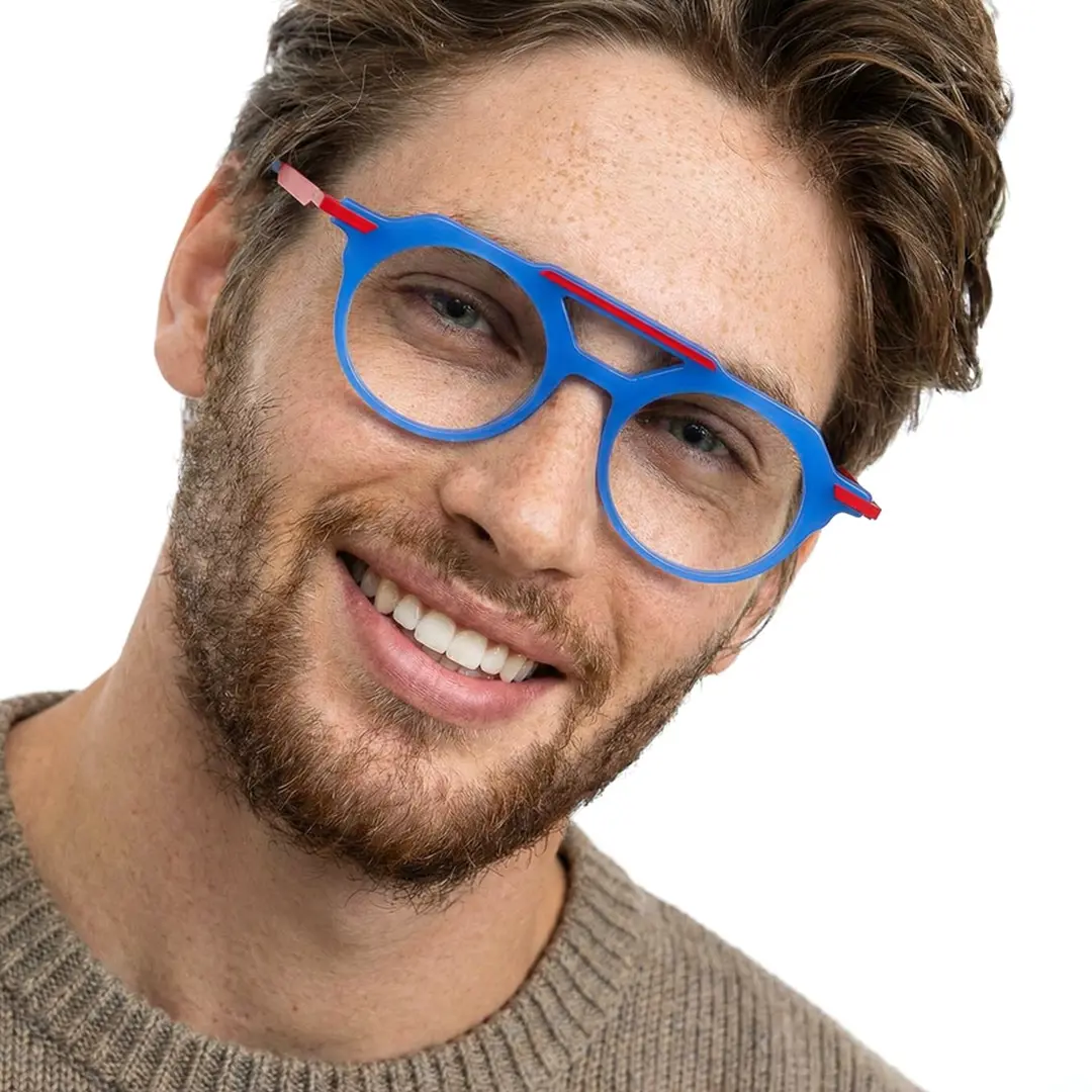 Three-quarter view of male wearing blue aviator eyeglasses, tilting head, soft smile, AA0082302