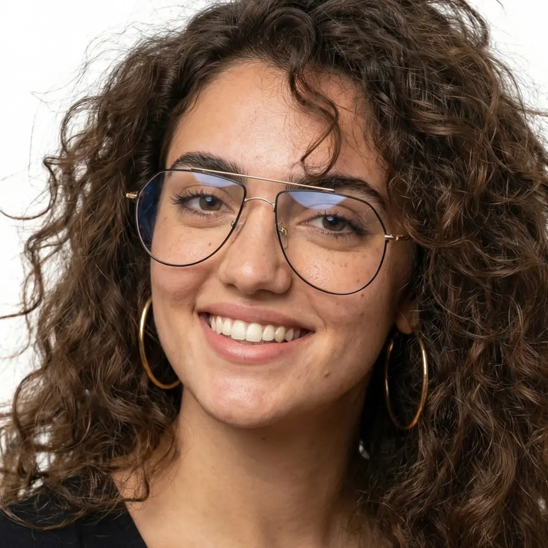 Face close-up view of female wearing vintage black aviator eyeglasses, friendly smile, AM0022603