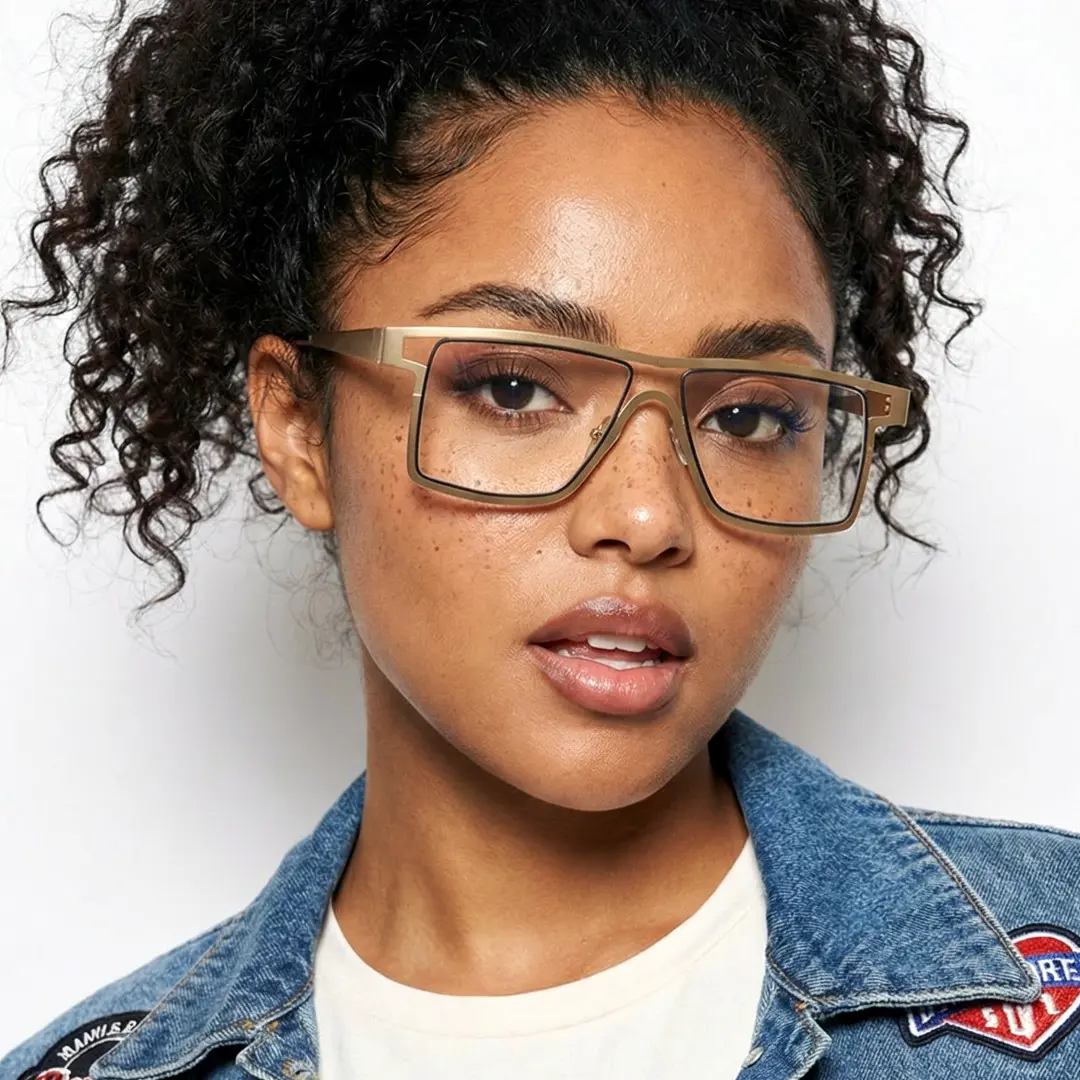 Looking straight ahead view of female wearing gold aviator eyeglasses, natural expression, AM0092212