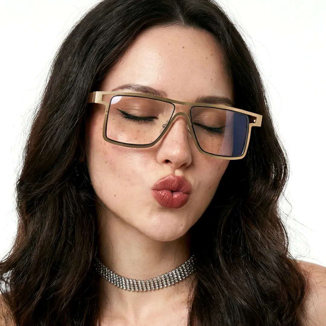 Three-quarter view of female wearing gold aviator eyeglasses, pouting, smiling, AM0092212