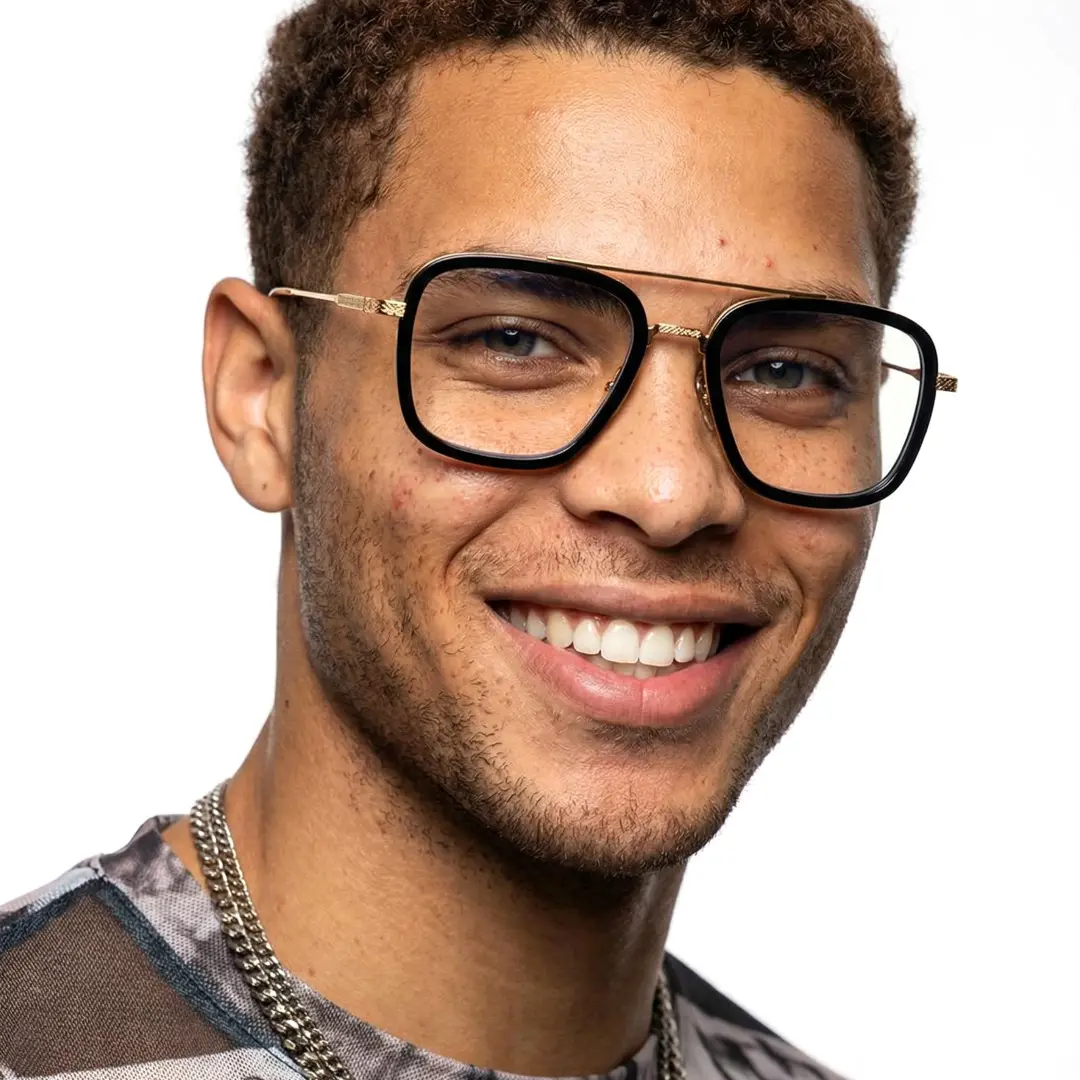 Front view of male wearing black gold aviator eyeglasses, friendly smile, AM0222409