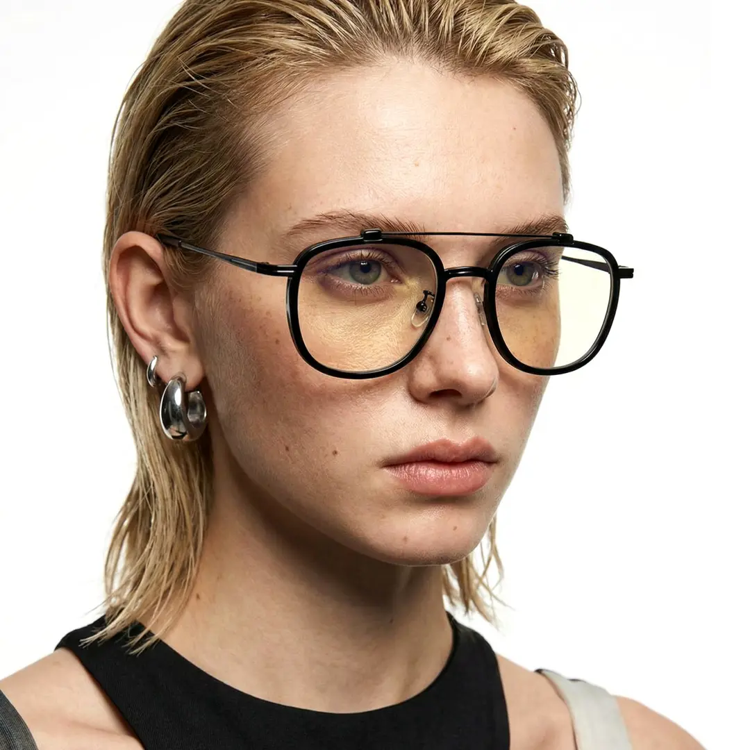 Looking away view of female wearing black aviator eyeglasses, neutral expression, AM0242410