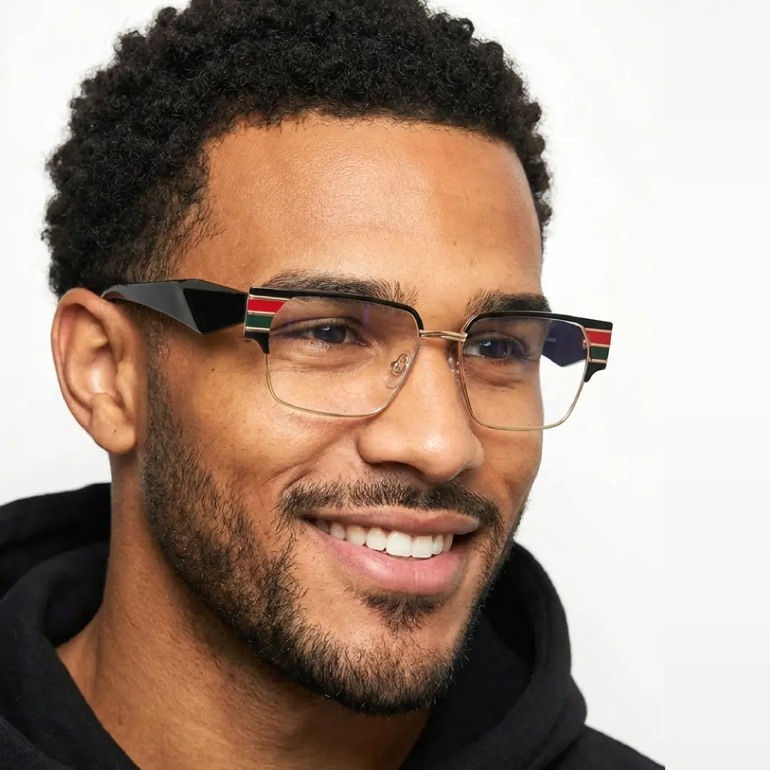 Looking away view of male wearing multicolor browline eyeglasses, soft smile, BM0092510