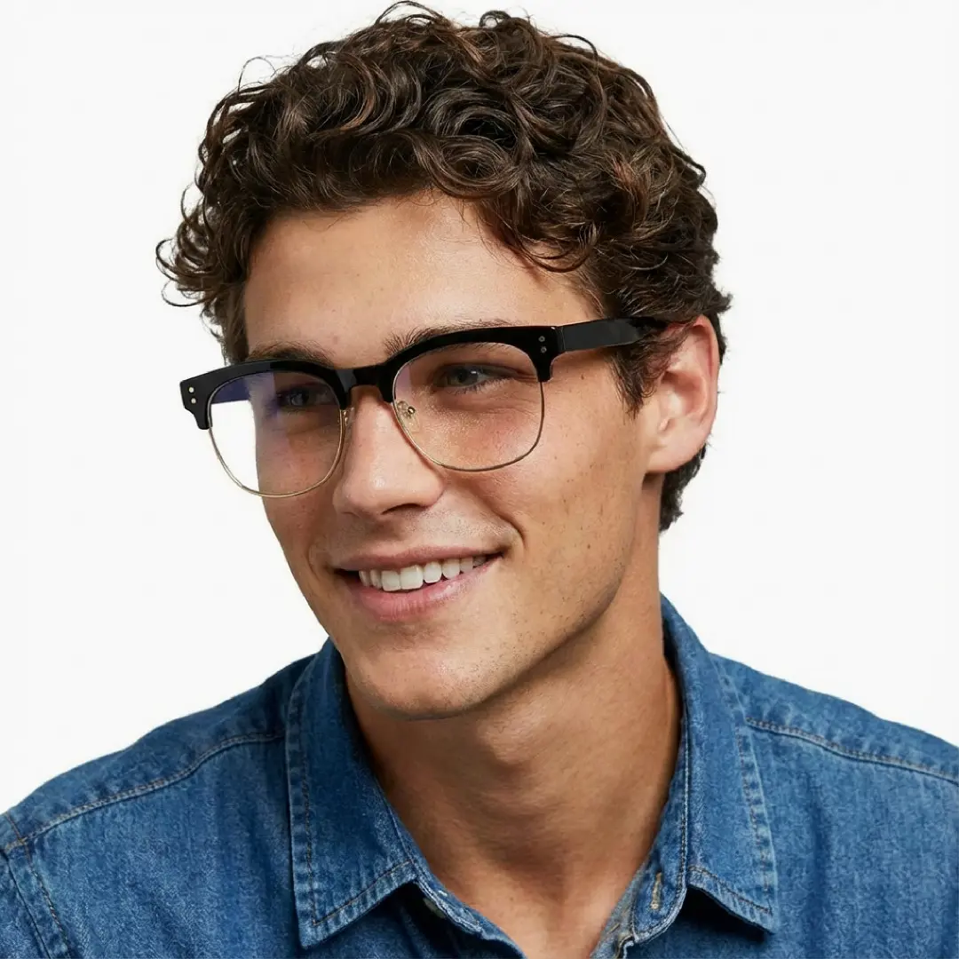 Looking away view of male wearing black & gold browline eyeglasses, soft smile, BR0012409
