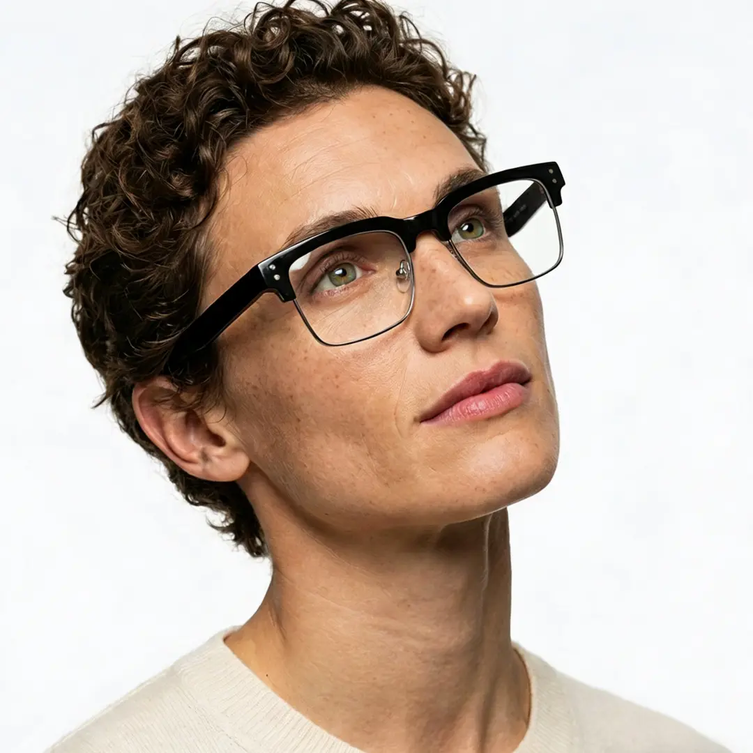 Looking away view of male wearing blackclear browline eyeglasses, relaxed expression, BR0572505