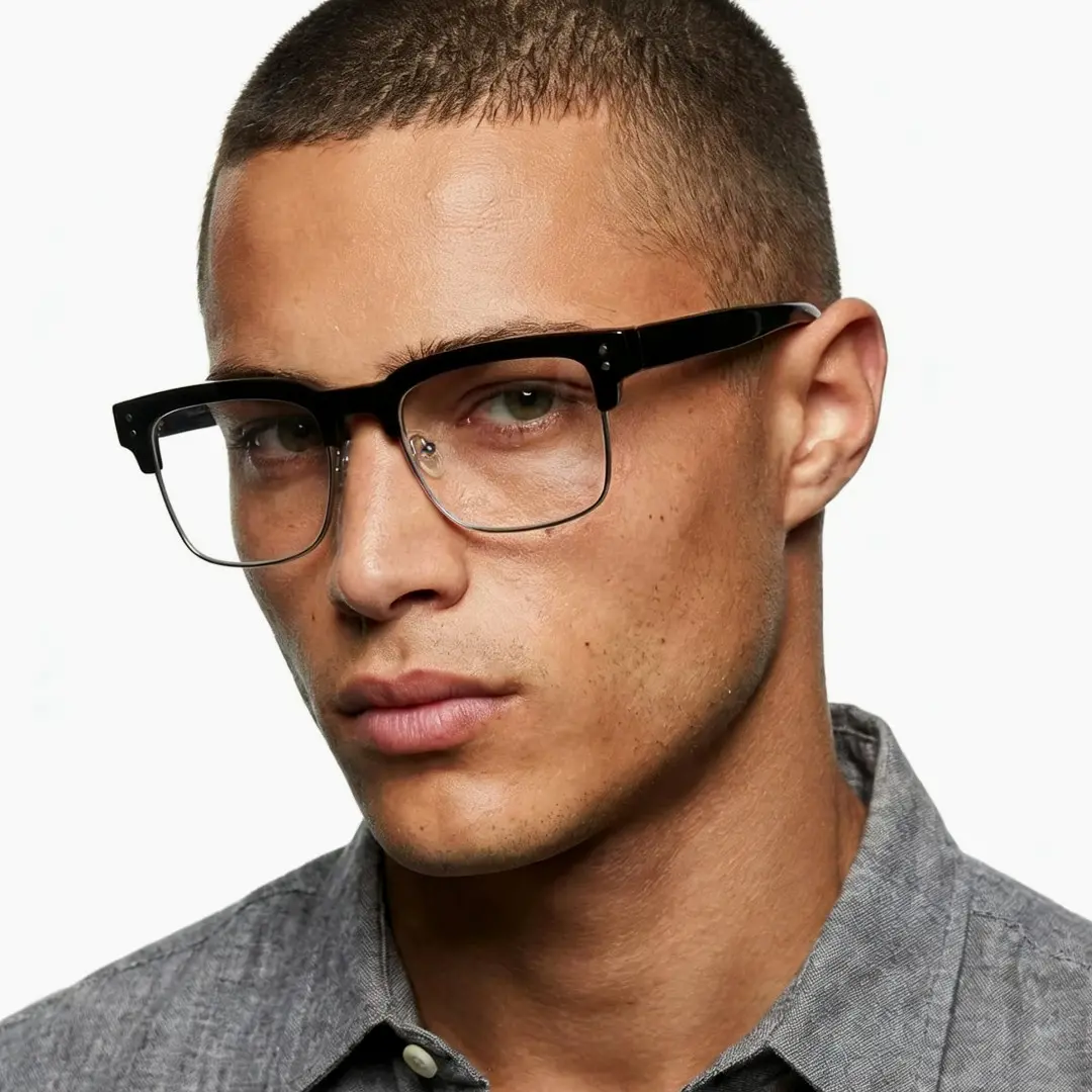 Three-quarter view of male wearing blackclear browline eyeglasses, calm expression, BR0572505