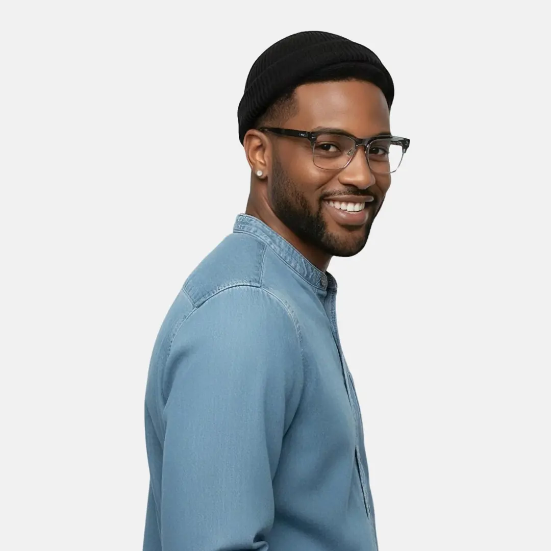 Profile view of male wearing grey browline eyeglasses, smiling, BR0572505