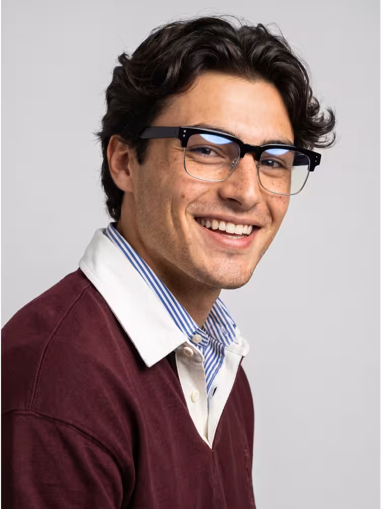 Male model wearing everyday black browline tr90 eyeglasses on plain gray studio background. SPU:BR0572505