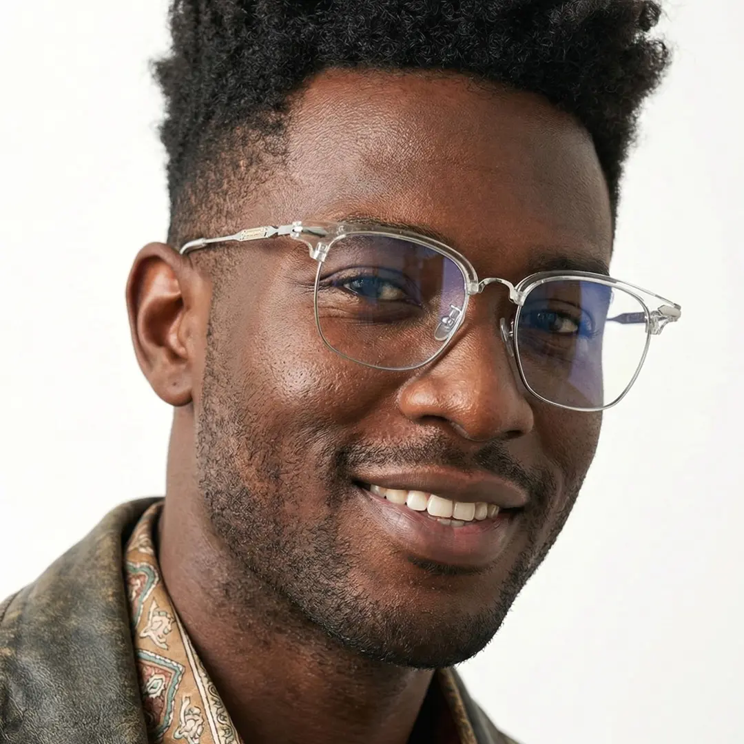Face close up of male wearing clear browline eyeglasses, smiling, BX0392509