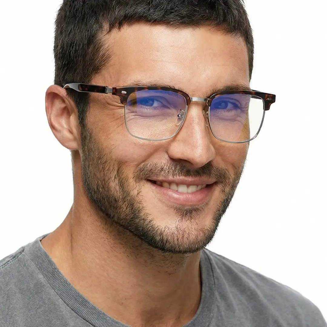 Three-quarter view of male wearing tortoise browline eyeglasses, natural smile, BX0402509