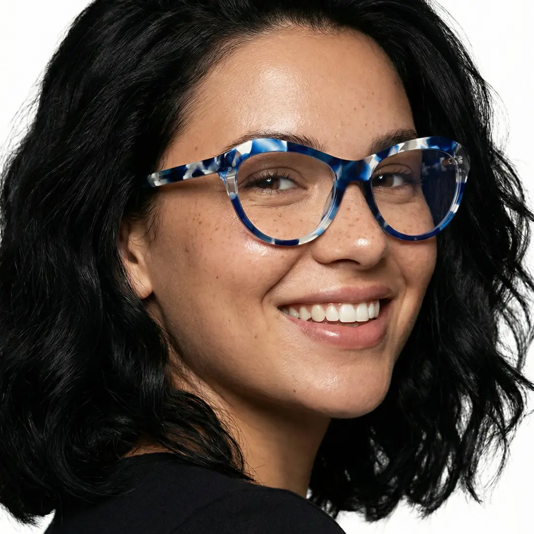 Over-the-shoulder view of female wearing colorful blue cat eye eyeglasses, smiling, CA0032302