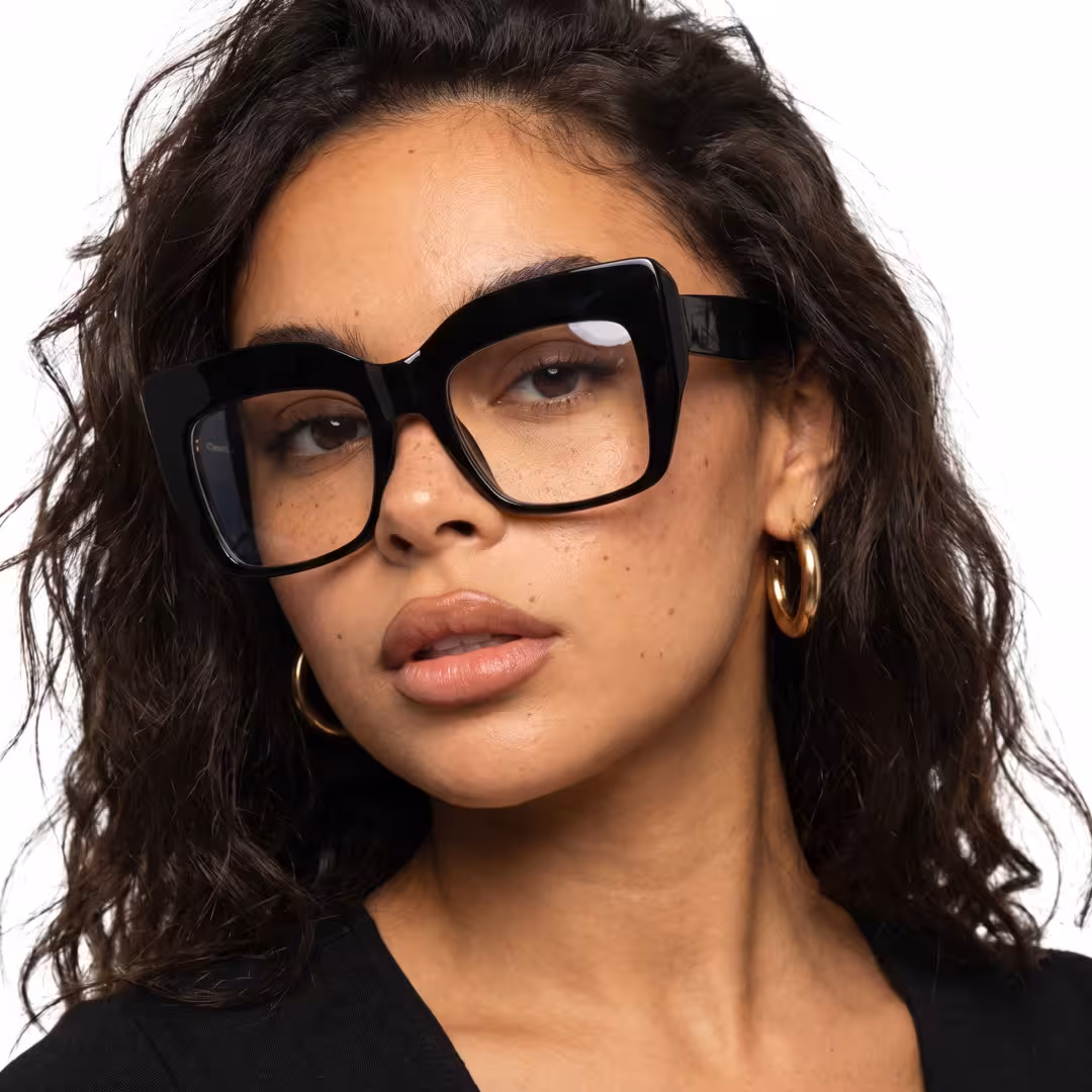 Front view of female wearing black cat eye eyeglasses, natural expression, CA0032503
