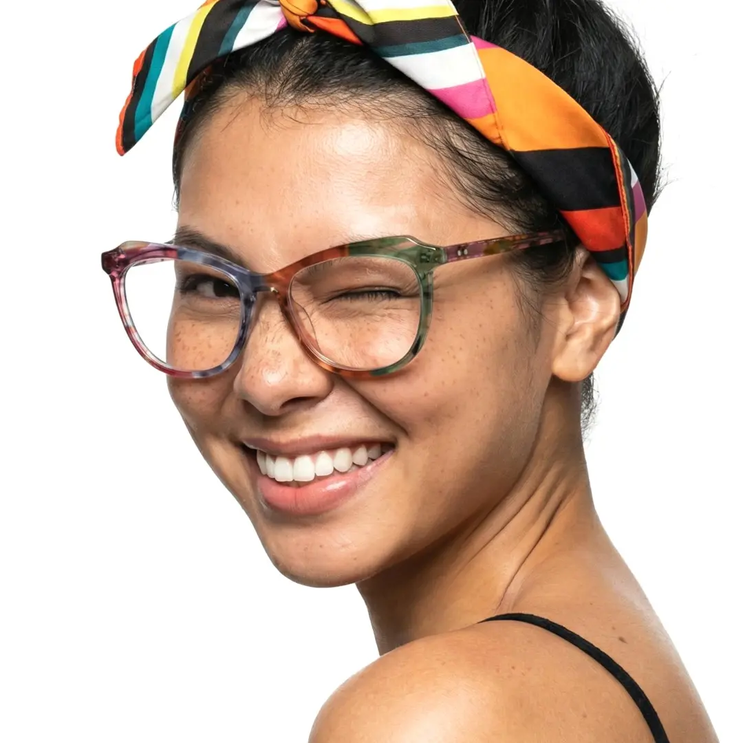 Profile view of female wearing multicolor cat eye eyeglasses, winking, smiling, CA0092306