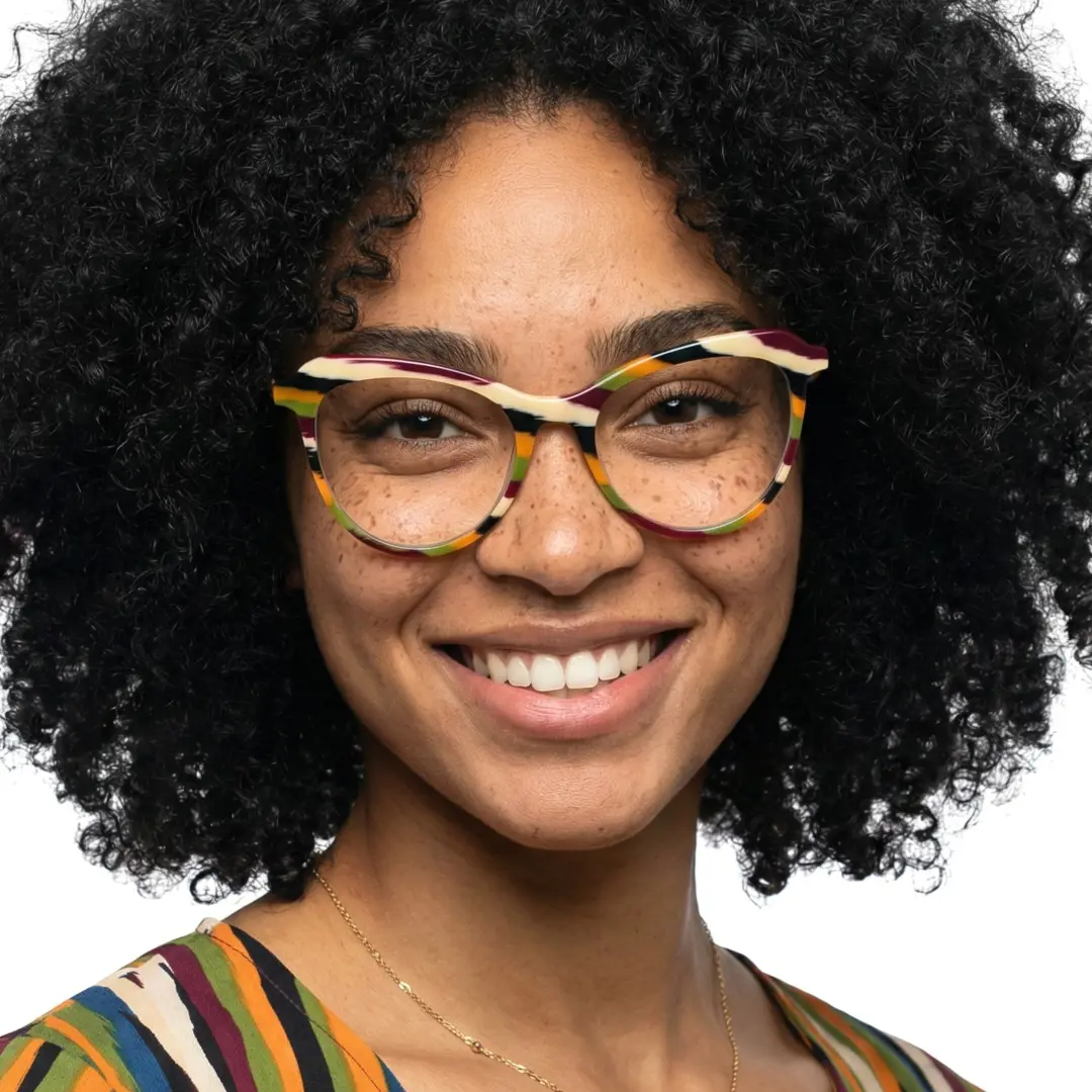 Looking straight ahead view of female wearing orange cat eye eyeglasses, smiling, CA0092306