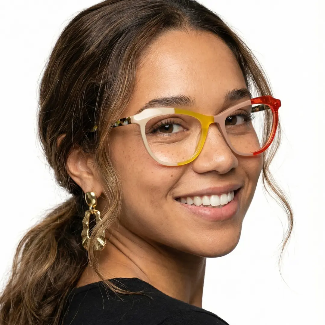 Slightly angled view of female wearing colorful yellow cat eye eyeglasses, smiling, CA0092306