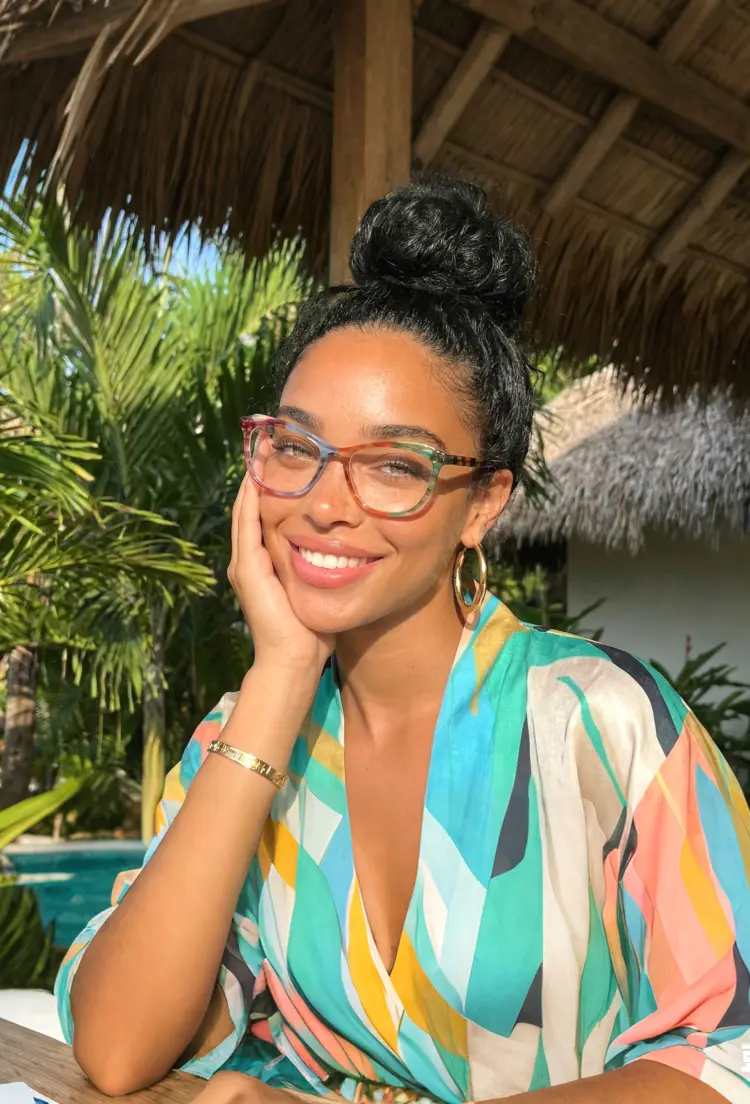 Female model wearing colorful multicolor cat eye acetate eyeglasses in a tropical resort. SPU: CA0092306