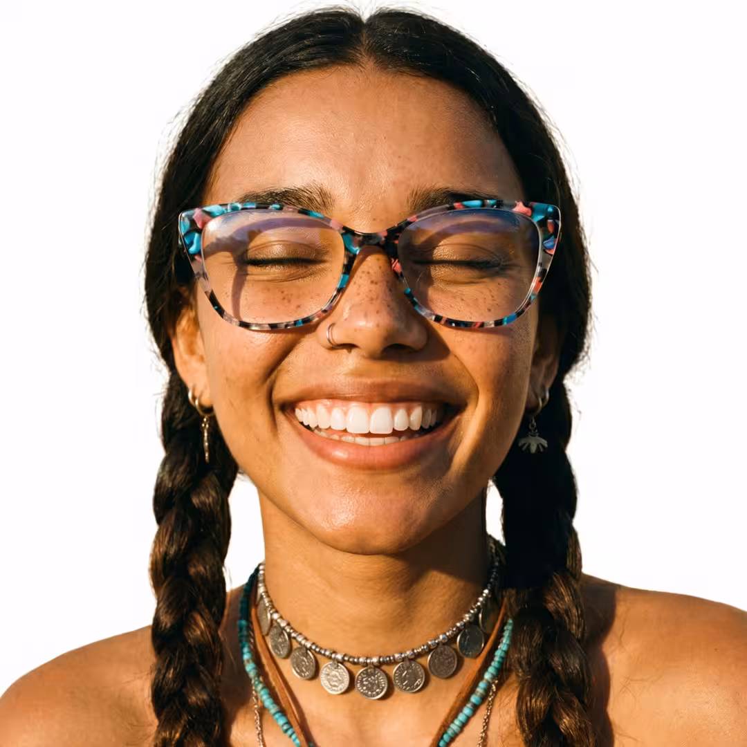 Close-up view of female wearing colorful blue tortoise cat eye eyeglasses, natural smile, CA0092307