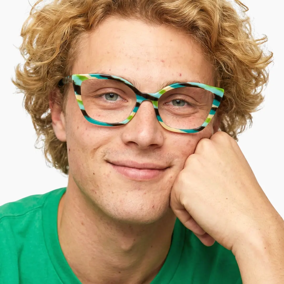 Front view of male wearing green cat eye eyeglasses, looking straight ahead, neutral expression, CA0102306