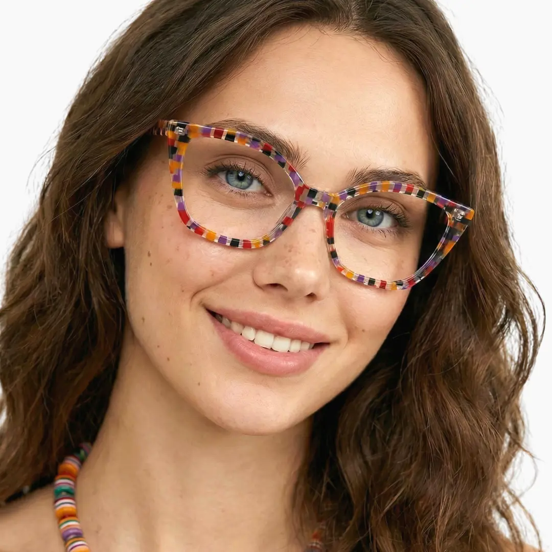 Three-quarter view of female wearing colorful purple cat eye eyeglasses, smiling, CA0102306