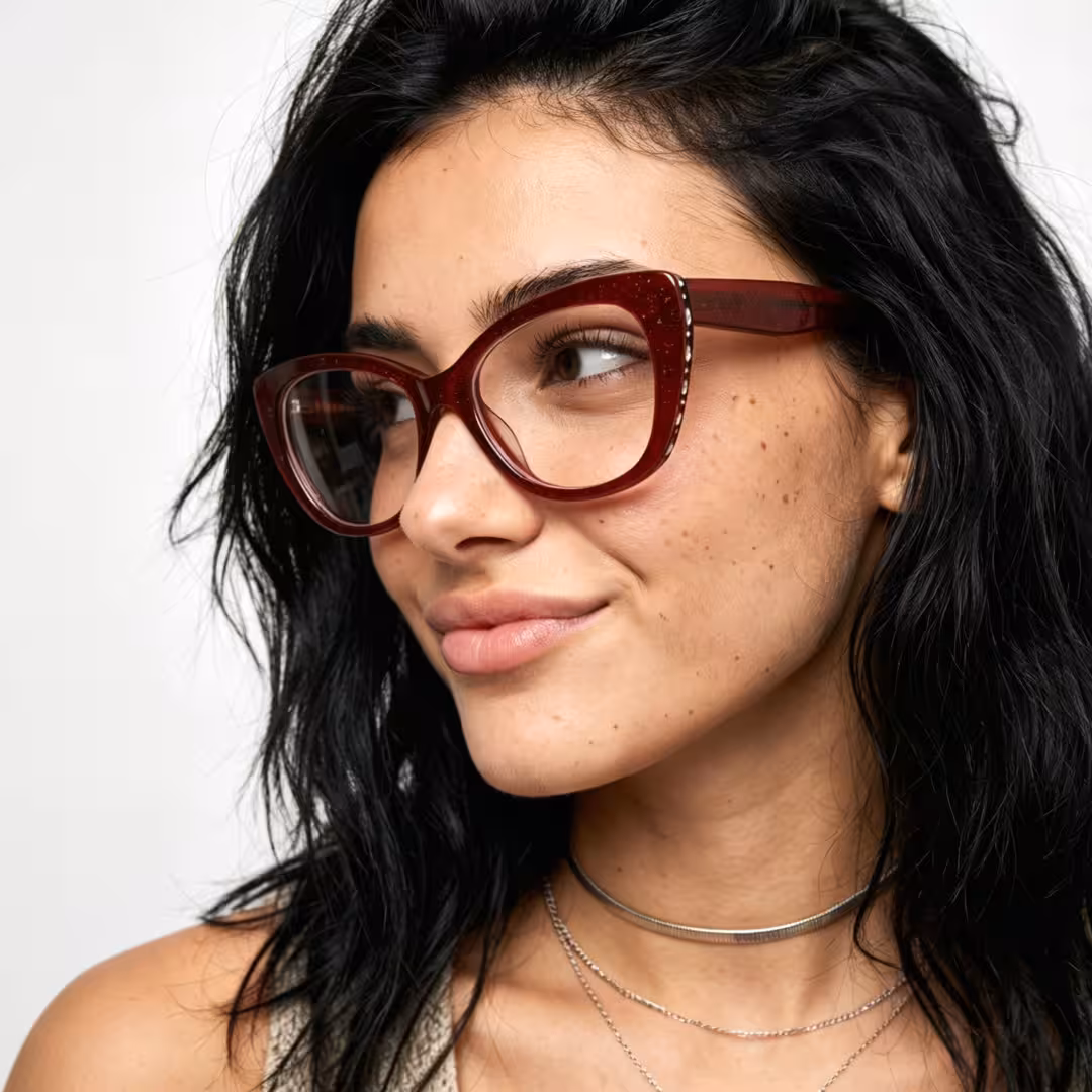 Profile view of female wearing red cat eye eyeglasses, natural smile, CA0152605