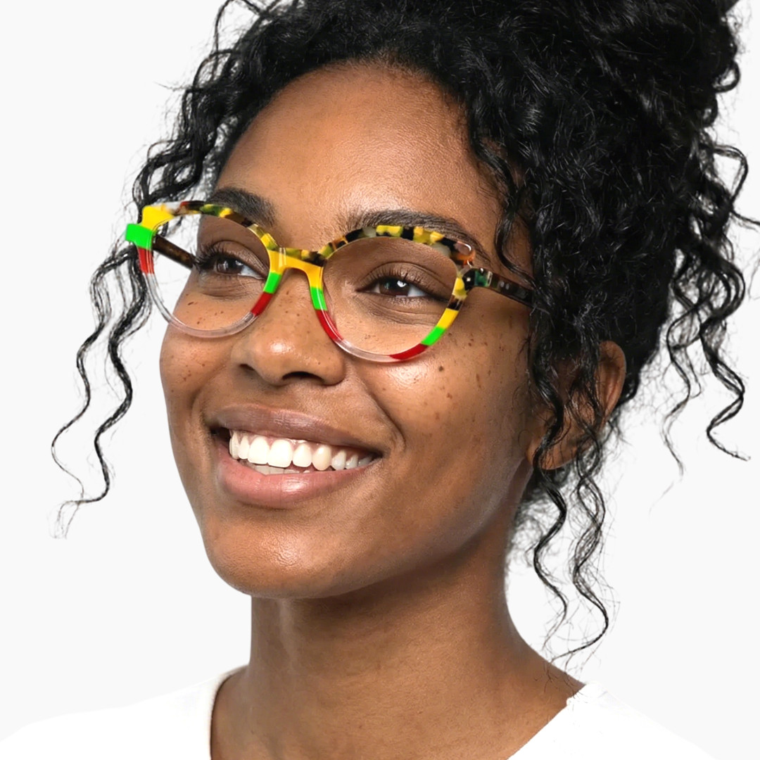 Looking away view of female wearing colorful multicolor cat eye eyeglasses, smiling, CA0222306