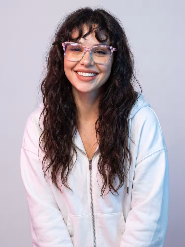 Female model wearing retro playful colorful pink cat eye acetate eyeglasses in studio setting. SPU: CA0332605