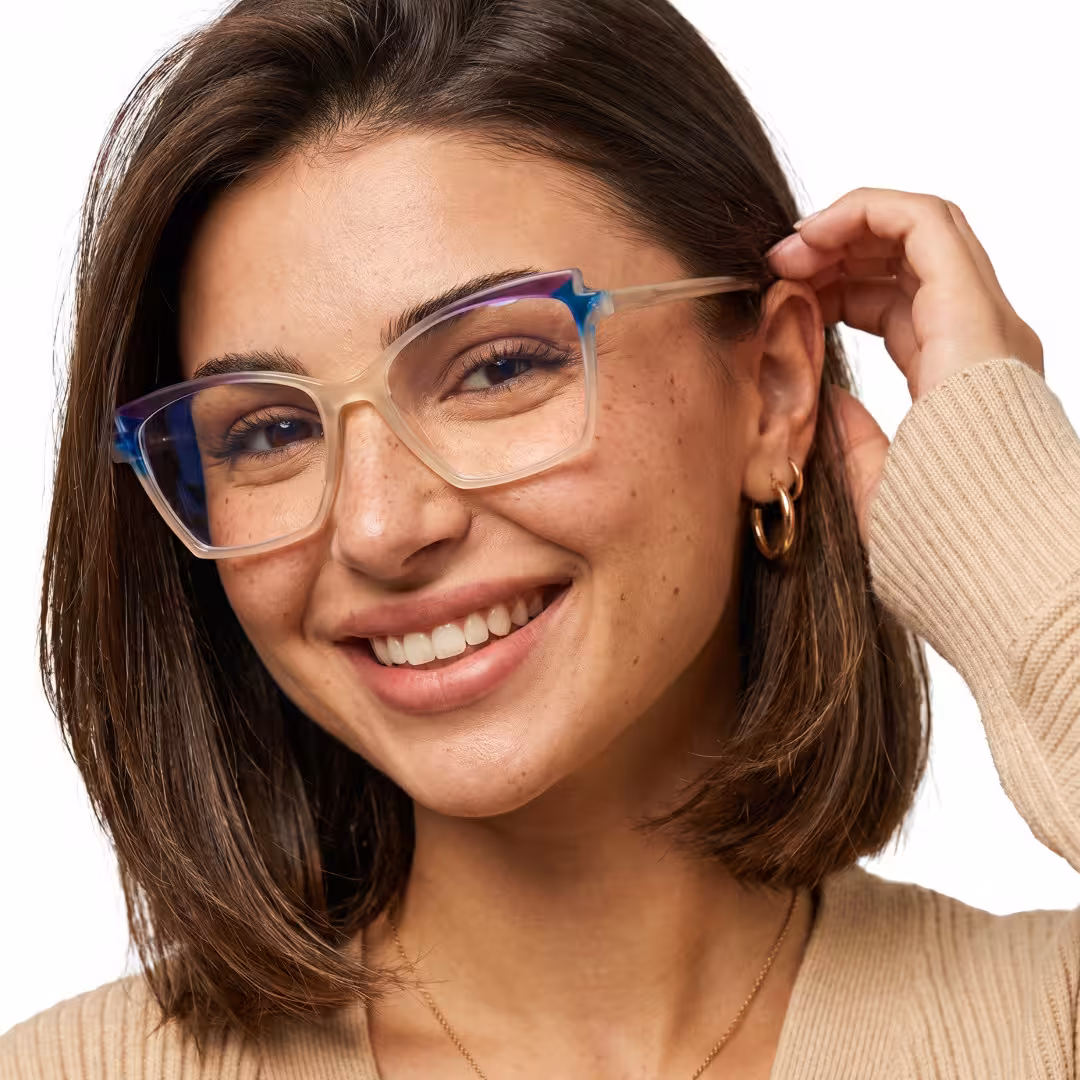 Female wearing colorful beige cat eye acetate eyeglasses, smiling while adjusting temples. SPU: CA0352605