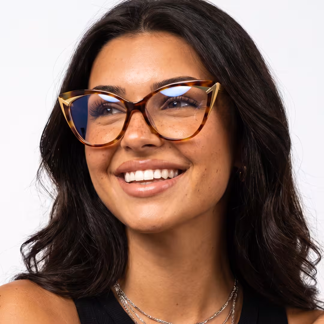Female wearing colorful tortoise cat eye acetate eyeglasses, smiling. SPU: CA0362605