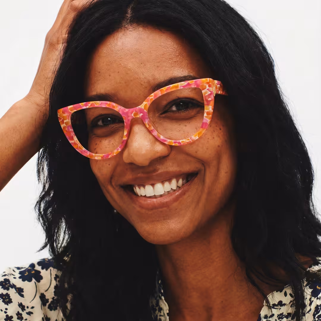 Female wearing colorful multicolor cat eye acetate eyeglasses, laughing while looking at camera. SPU: CA0392605