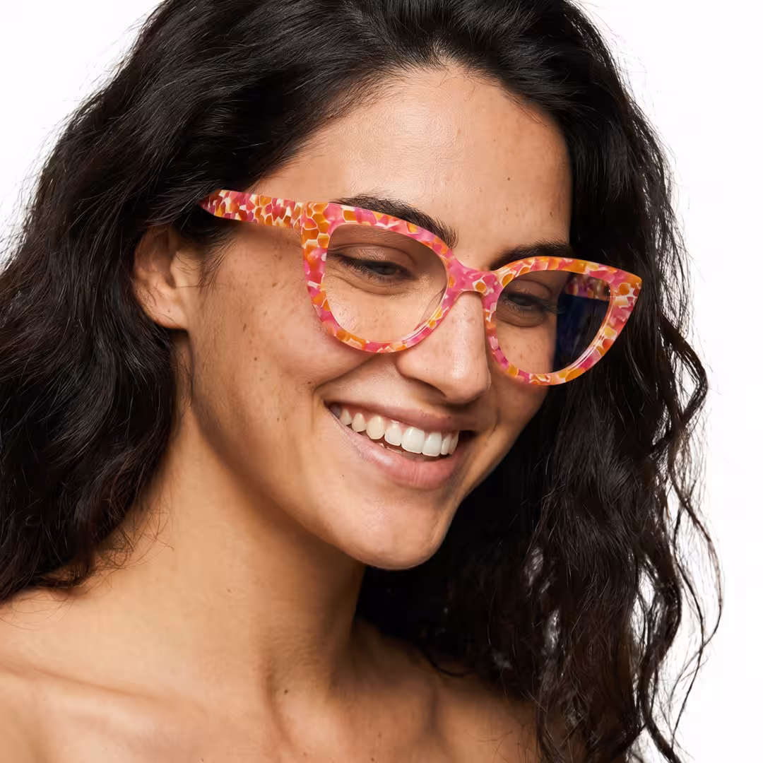 Female wearing colorful multicolor cat eye acetate eyeglasses, smiling while looking away. SPU: CA0392605