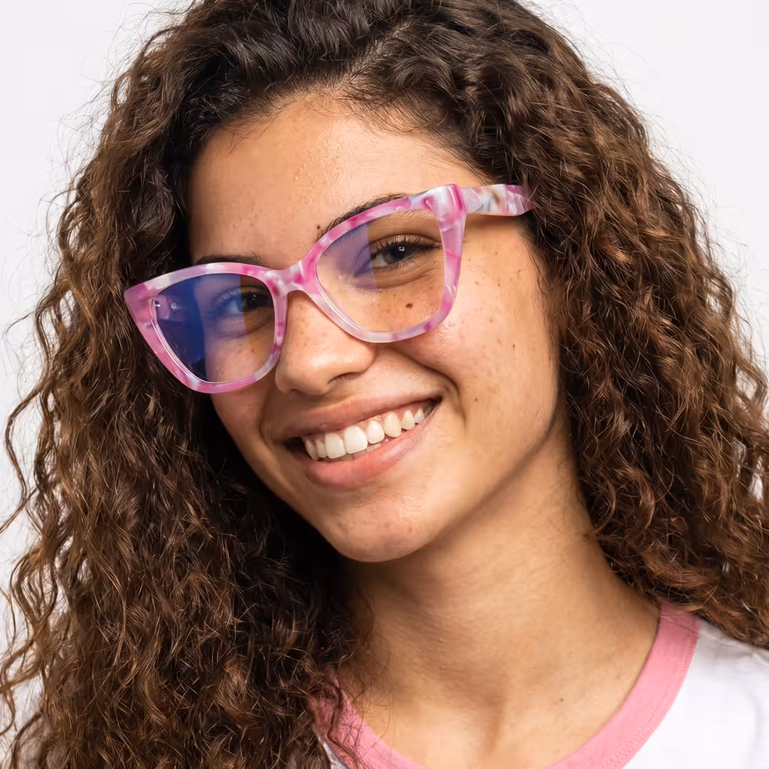 Female wearing colorful pink cat eye acetate eyeglasses, smiling while looking at camera. SPU: CA0432605