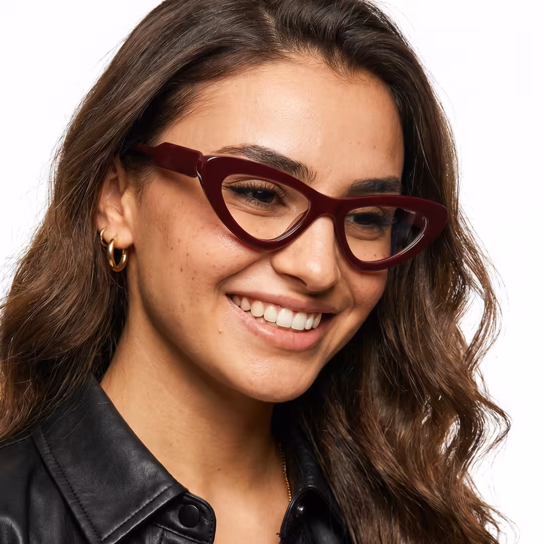 Female wearing office siren red cat eye acetate eyeglasses, smiling. SPU: CA0462605