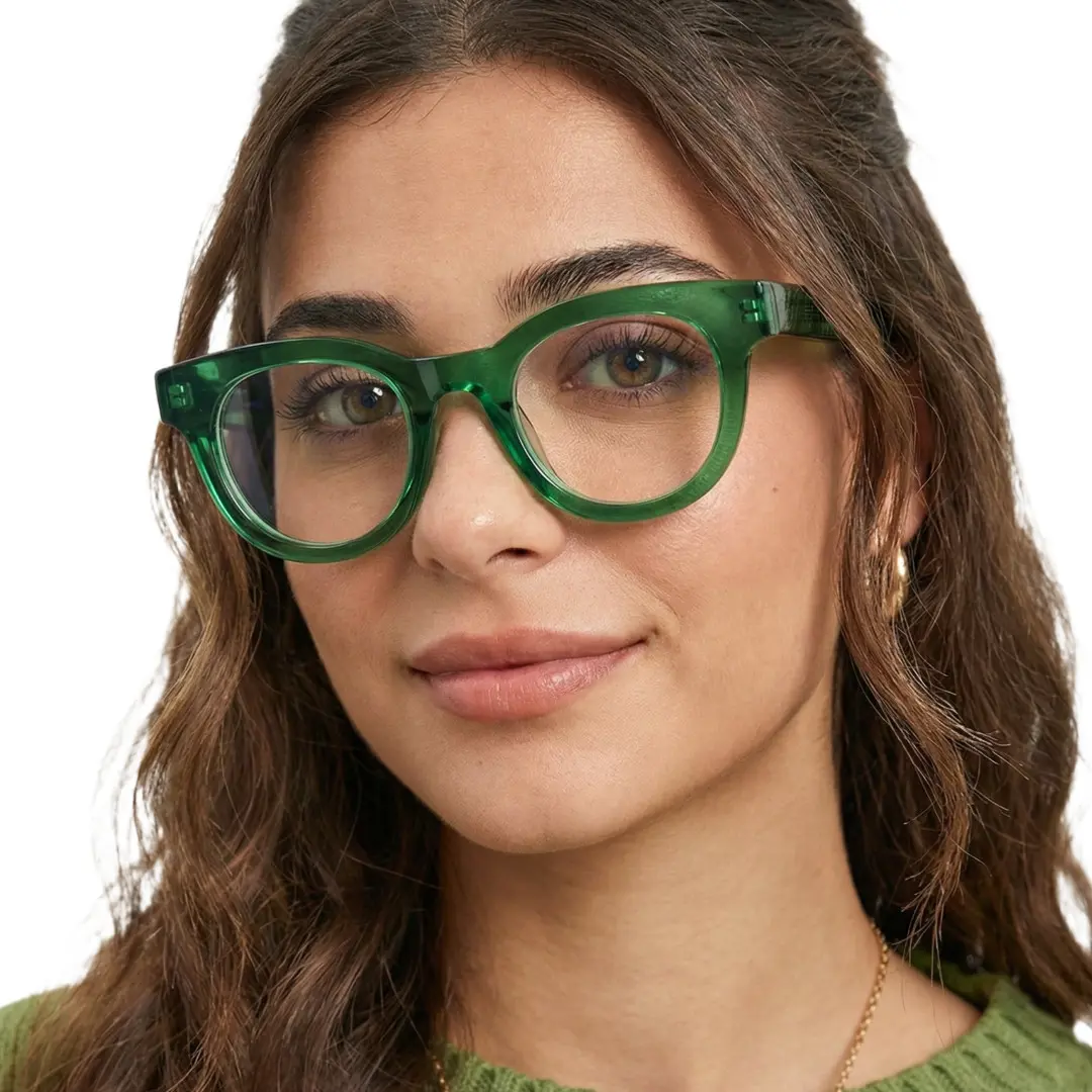 Face close-up view of female wearing green round eyeglasses, neutral expression, CA0532302