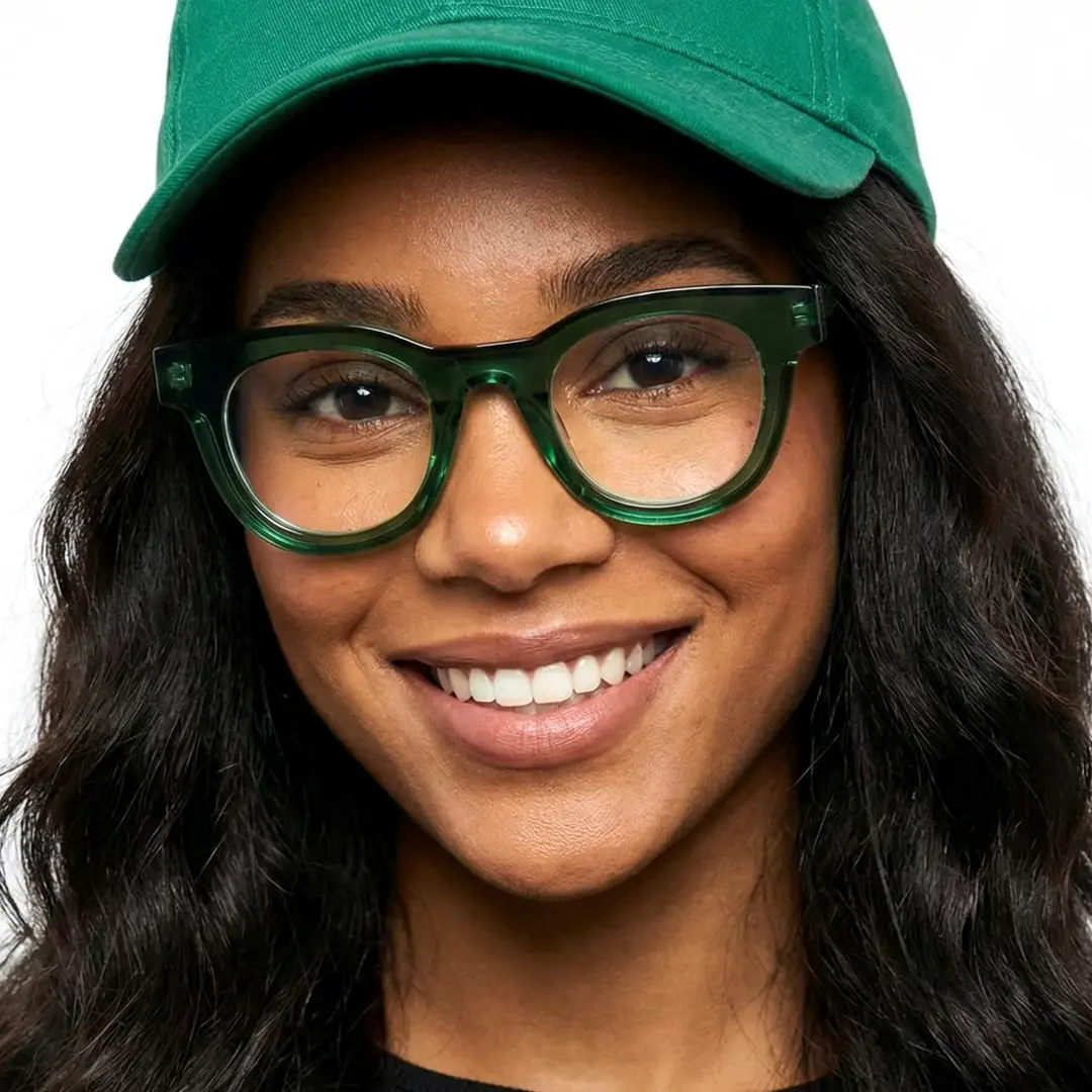 Front view of female wearing green round eyeglasses, smiling, CA0532302