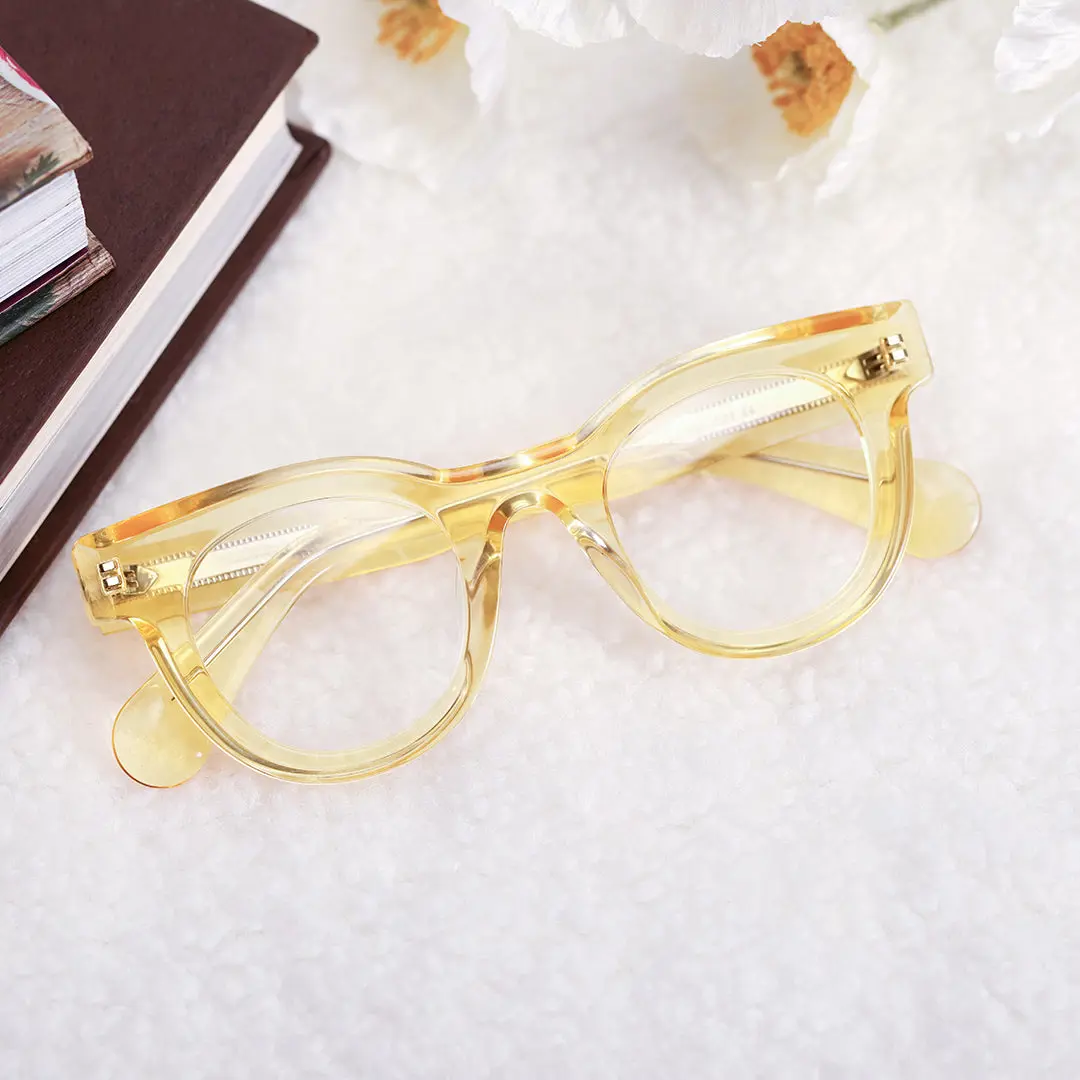Front folded view of Gali round acetate eyeglasses CA0532302 in yellow