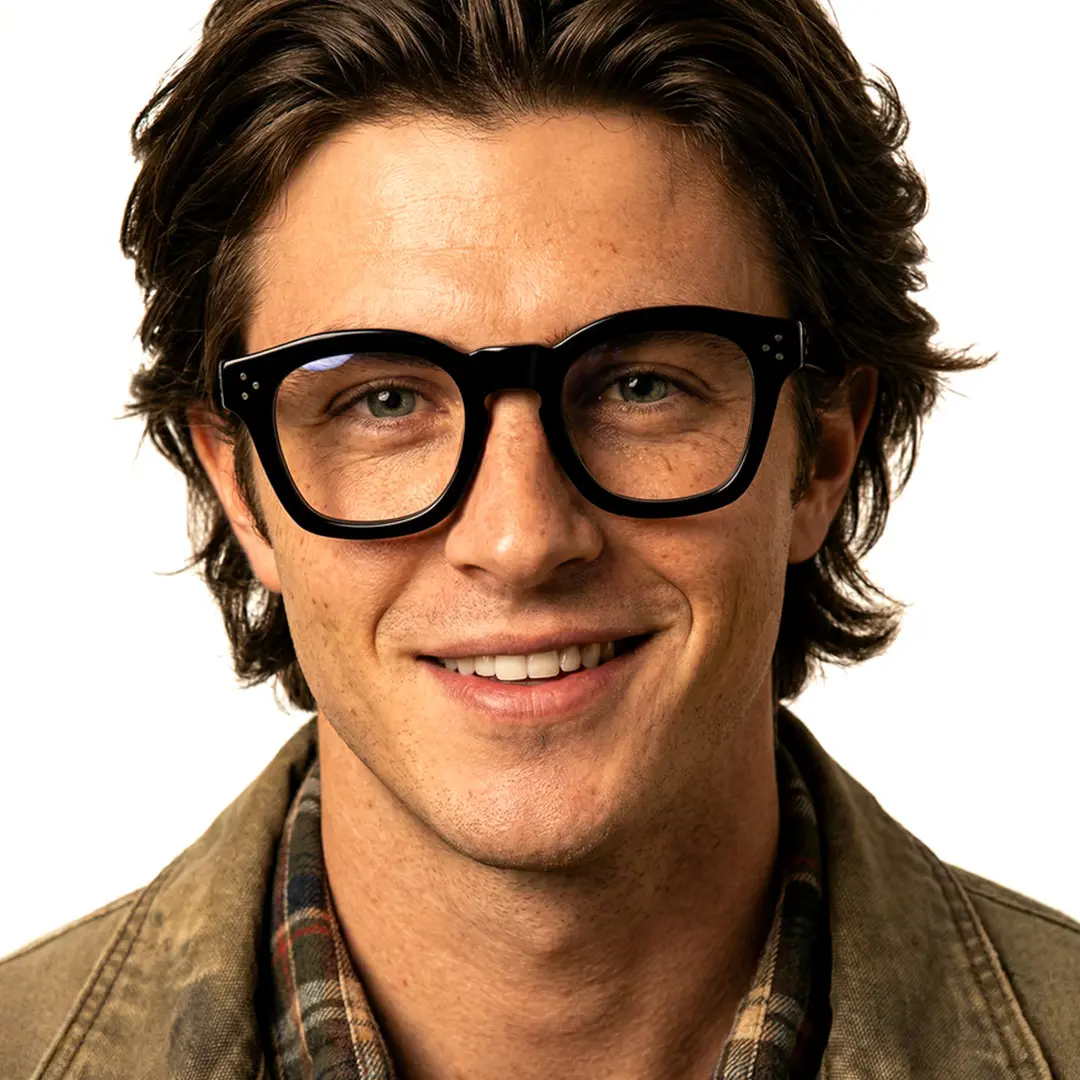Front view of male wearing black cat eye eyeglasses, smiling, CA0542302