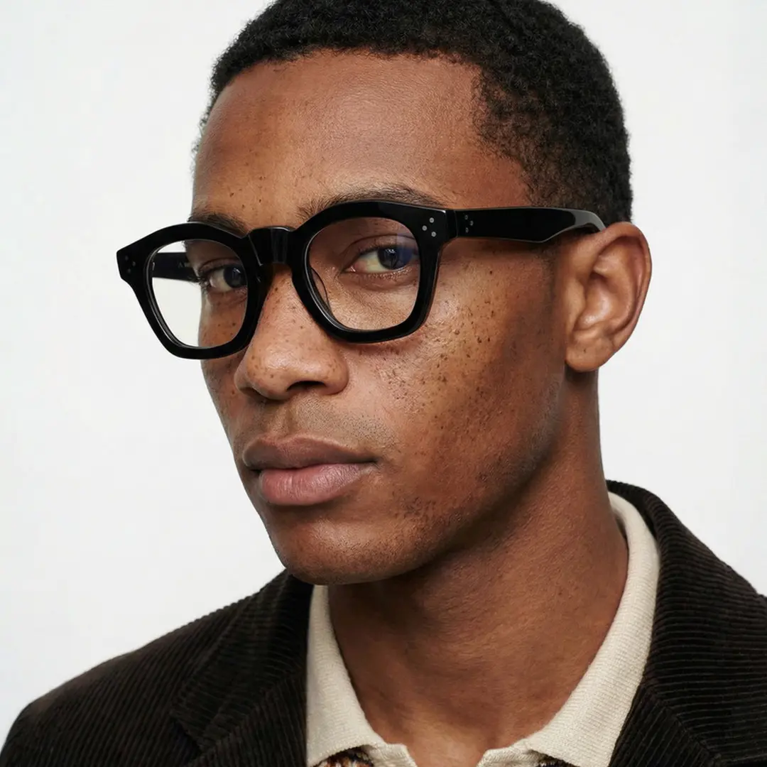 Profile view of male wearing vintage black cat eye eyeglasses, neutral expression, CA0542302