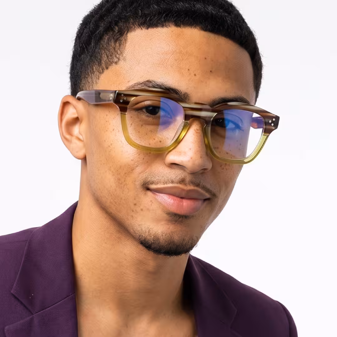 Male wearing vintage brown cat eye acetate eyeglasses, giving a subtle smile while looking at camera. SPU: CA0542302