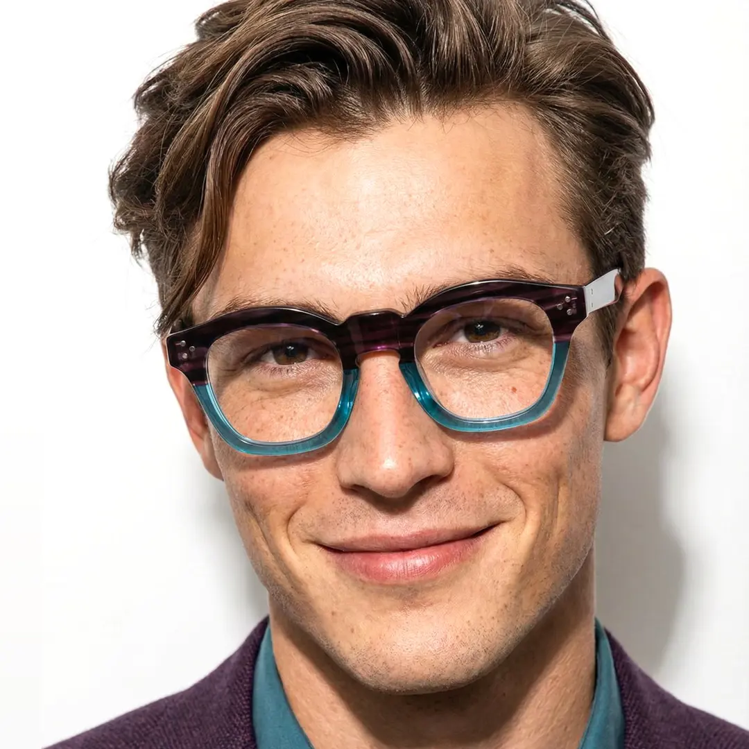 Front view of male wearing blue tortoise cat eye eyeglasses, neutral expression, CA0542302