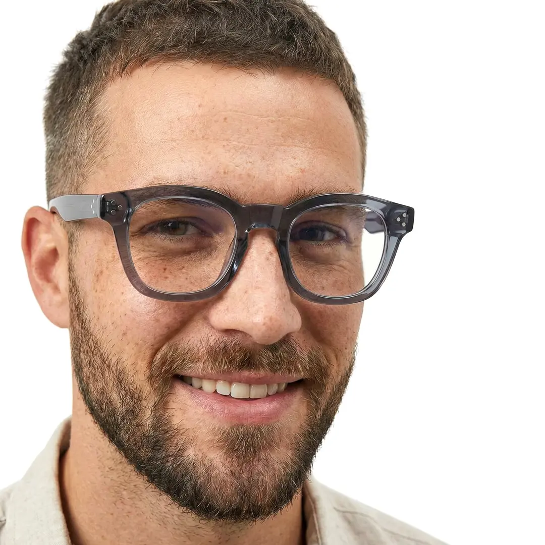 Close-up view of male wearing vintage grey cat eye eyeglasses, natural smile, CA0542302