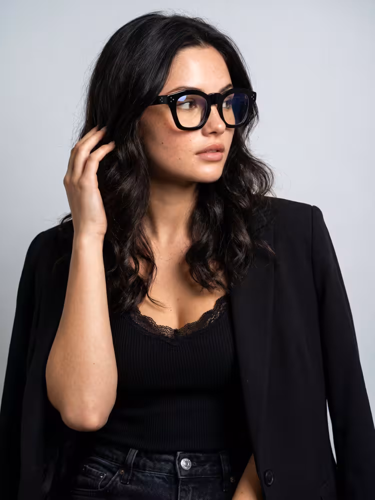 Female model wearing vintage black cat eye acetate eyeglasses in a studio setting. SPU: CA0542302